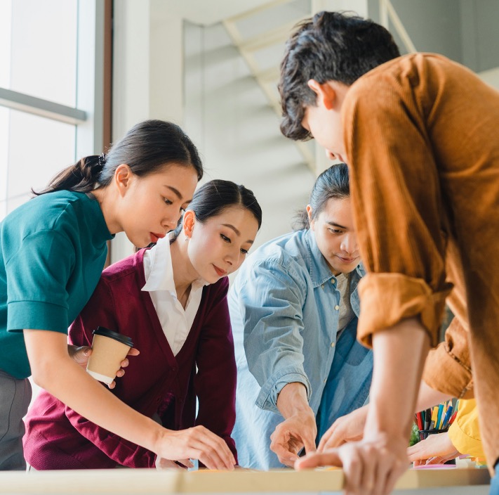 Group of diverse professionals collaborating at a table