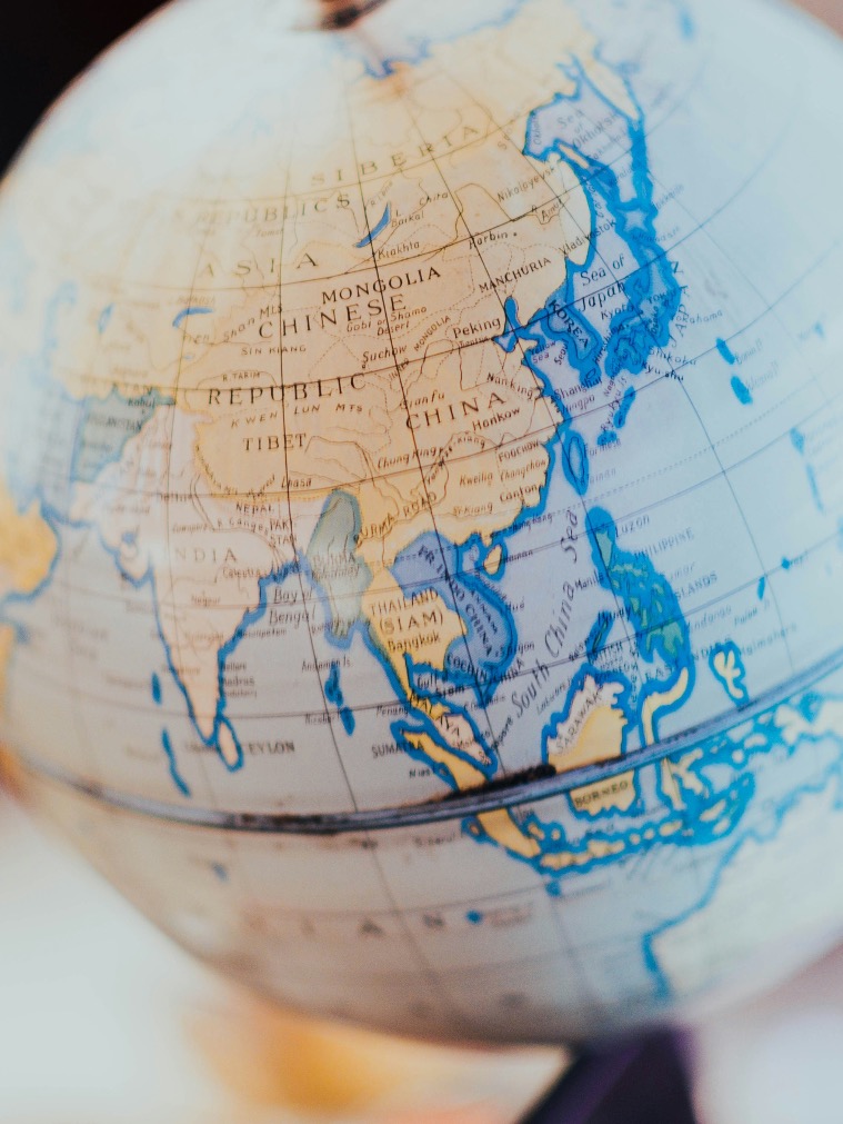 Globe with pin marking a location